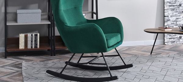 un fauteuil à bascule vert